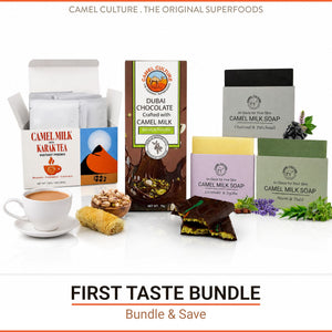 Camel Culture First Taste Bundle featuring Camel Milk Karak Tea, Dubai Chocolate coated with Camel Milk, Camel Milk Soap bars, and a cup of camel milk tea with nuts and a piece of cake on a white background.