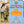 Woman walking a dog with Camel Culture product packaging in the background